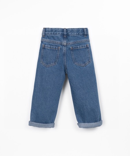 Denim trousers with adjustable belt