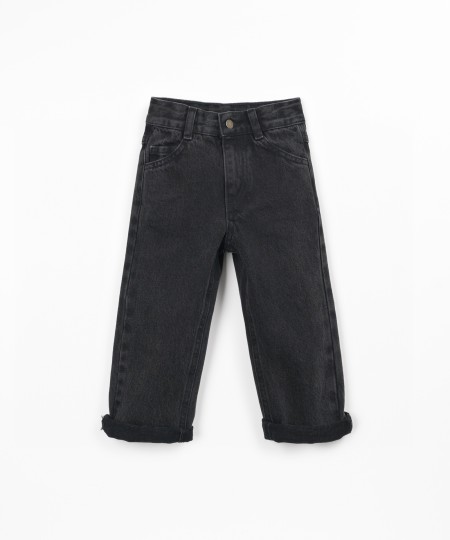 Denim trousers with adjustable belt