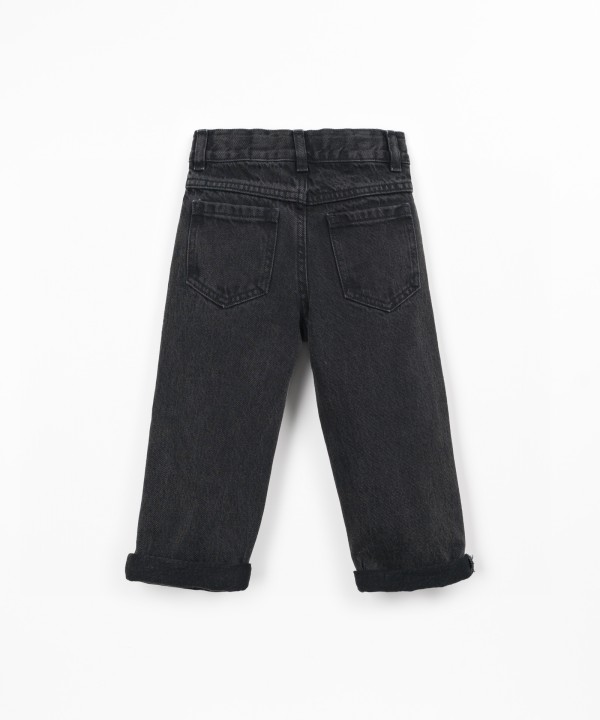 Denim trousers with adjustable belt