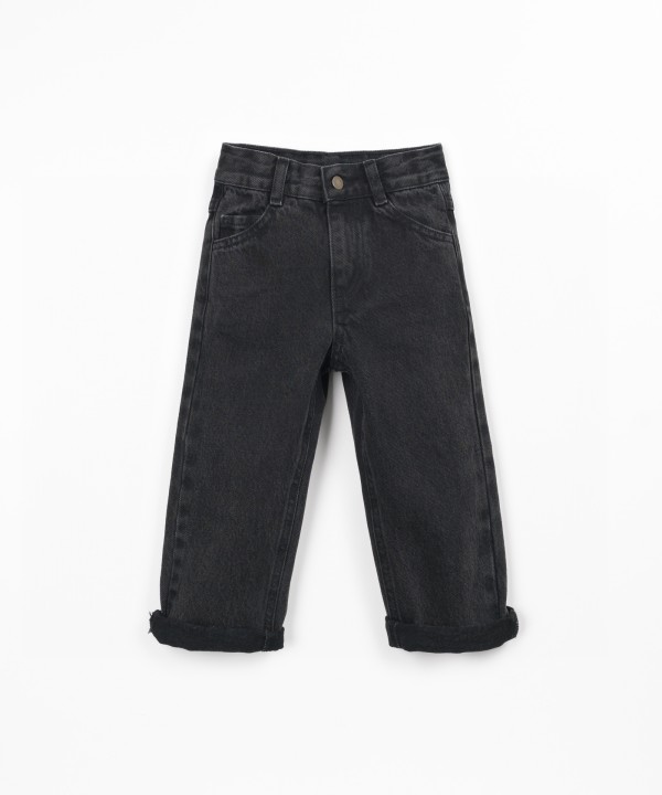 Denim trousers with adjustable belt