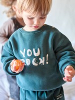 Knitted sweater with brushed interior