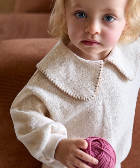 Knit sweater with recycled fibers