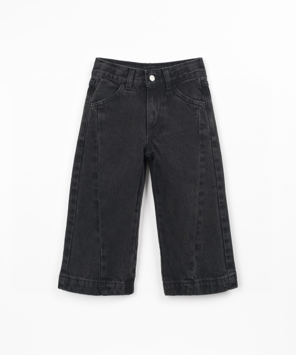 Denim trousers with adjustable waistband