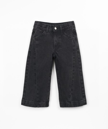 Denim trousers with adjustable waistband