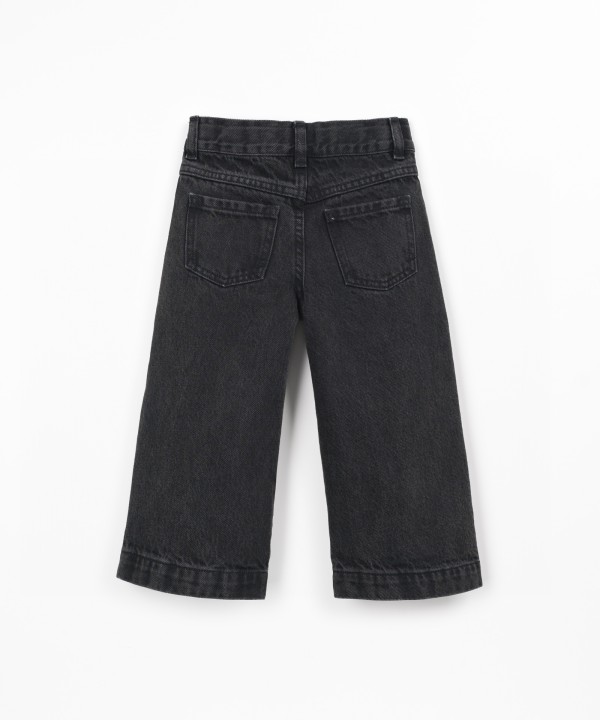 Denim trousers with adjustable waistband
