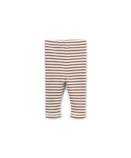 Leggings a rayas con botones decorativos de coco.