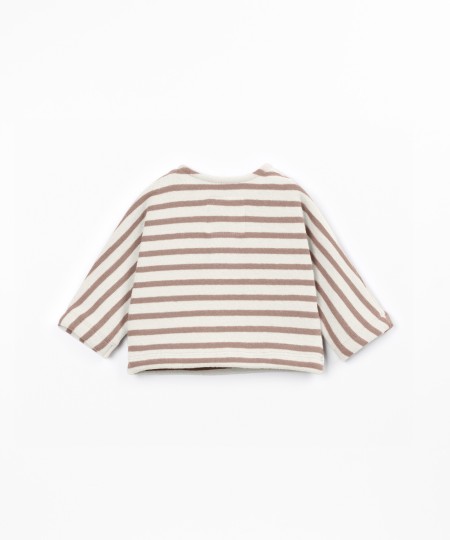 Knit sweater with a blend of natural fibers and recycled cotton