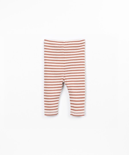 Striped leggings with decorative coconut buttons