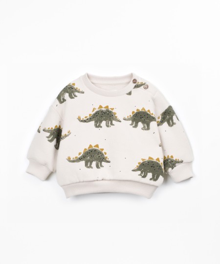 Knit sweater with shoulder opening