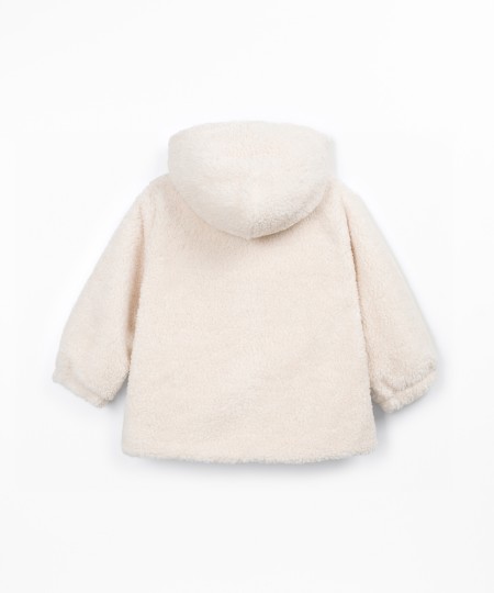 Veste en fourrure à capuche