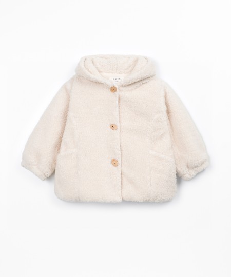 Veste en fourrure à capuche